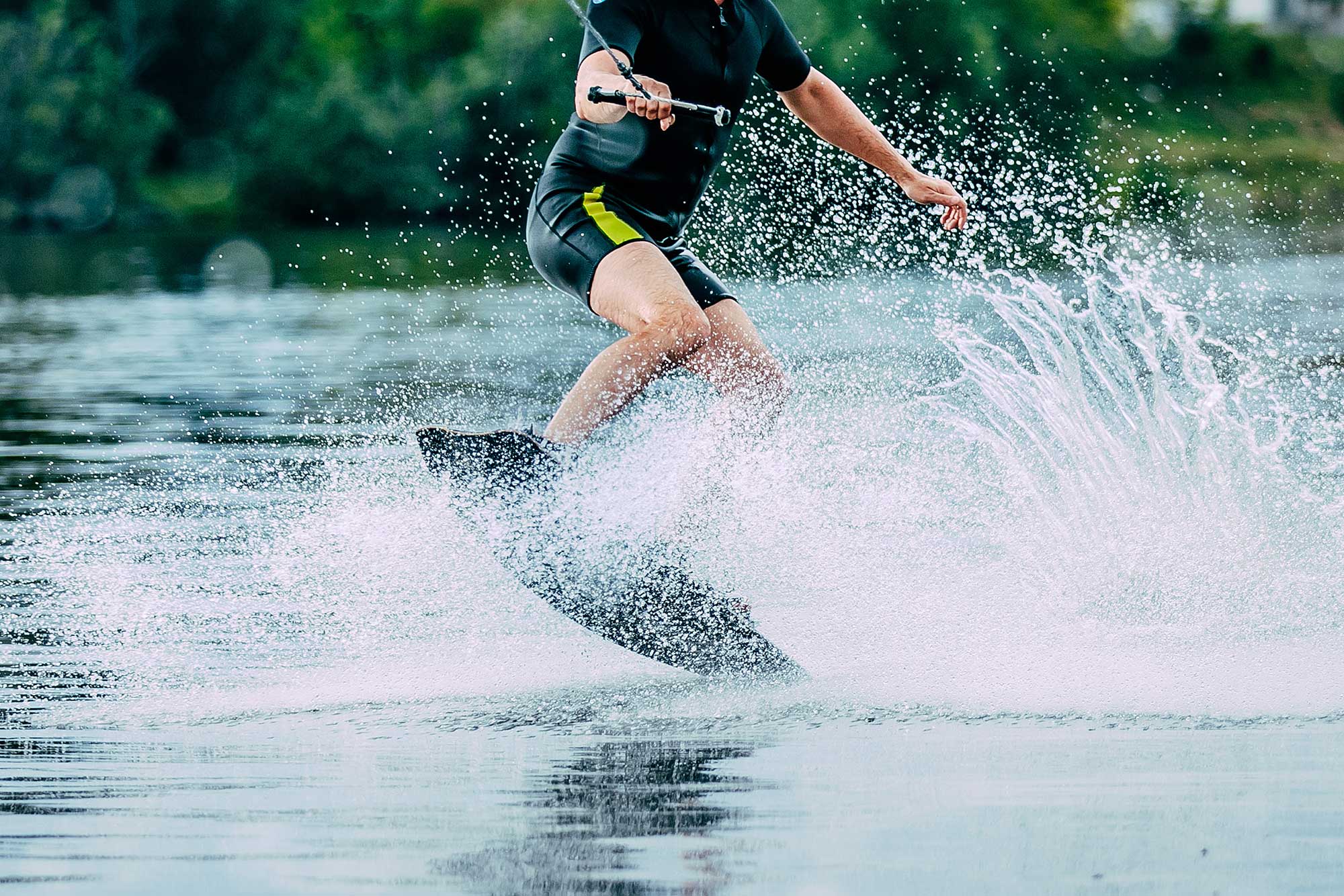 man jumps on wakeboard wave sm 1